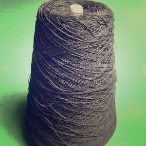 Black acrylic cone of yarn